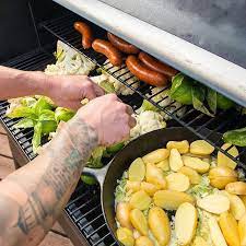 Make Your Whole Meal At Once With Traeger S All In One Cooking Versatility Today S Feast Spicy Sausage Fingerling Potatoes Recipes Traeger Recipes Culinary