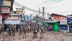 Army holds flag march restive