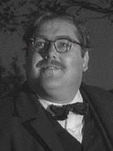 Chapeau melon et bottes de cuir