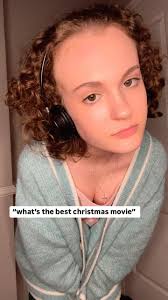 merry christmas eve!!!!! don’t be a cotton headed ninny muggins 😜🎄, -, -,  [ Visual Description: Grace (a young white woman with hair in short brown  curls) wears a pink tank top and blue sweater, and ...