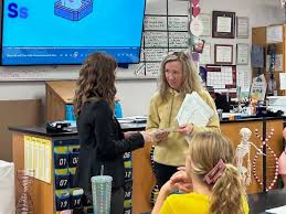 So proud of our daughter, Julie Lusk Zemojtel for being chosen as Lake  Havasu High School Teacher of the Year for 2024 yesterday. It was a great  honor and she is so