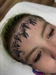 Image result for quirky pylon forehead tattoo