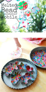 A Mobile From Melted Plastic Bead Suncatchers Artful Parent Christmas Ornament Crafts Melted Bead Suncatcher Crafts For Kids