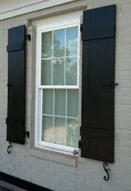 Custom Black Board And Batten Wood Shutters House Shutters Shutters Exterior Wood Shutters Exterior