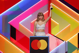 Taylor swift wore a miu miu crop top and skirt set for the 2021 brit awards, causing fans to wonder if she's release 1989 (taylor's version) soon. Taylor Swift Thanked Boyfriend Joe Alwyn During Her Brit Awards Acceptance Speech
