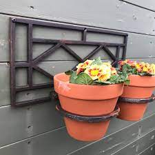 The pot rack simply hangs from the ceiling of your kitchen, freeing up valuable storage space by offering an area to. Plant Pot Holder Wall Mounted The Rustic Merchant S Range Of Pot Holders
