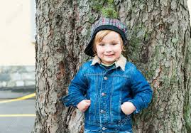 Toddler boy with short haircuts looks nothing less than cute! Outdoor Portrait Of A Cute Toddler Boy Wearing Jeans Jacket And Stock Photo Picture And Royalty Free Image Image 36921684