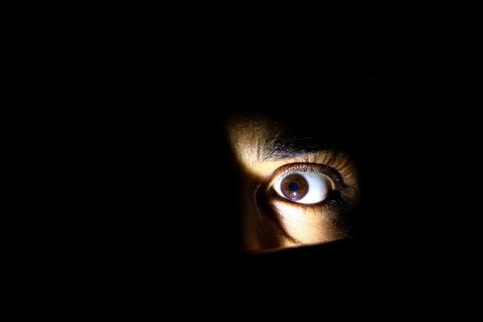 A person's eye is seen through the dark - Free Photo on Unsplash