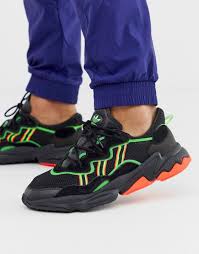 Black And Neon Orange Adidas Shoes Adidas Originals Ozweego Sneakers In Black With Neon Stripes In 2020 Sneakers Adidas Originals Neon Stripes