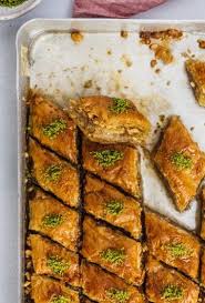 Newly Baked Turkish Baklava Dessert Filled With Walnuts And Topped With Pistachio In A Baking Sheet Turkish Baklava Baklava Recipe Easy Turkish Baklava Recipe