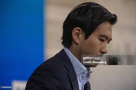 Eric Liu, chief executive officer of Vanda Research Corp., listens... News  Photo