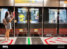 Singapore MRT train arriving at Bayfront station near Marina Bay — the fastest way to get between attractions in the city