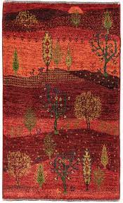 A gabbeh rug has a simple design, hand knotted with pure wool dyed naturally, finished with a thick pile. Roter Nomadenteppich Red Summer Teppich Jordan