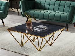 Die pulverbeschichteten, schwarzen metallstreben des untergestells sind miteinander verbunden und sorgen dabei für zusätzliche. Couchtisch Mindi Marmor Metall Schwarz Goldfarben Kaufen Bei Kauf Unique De