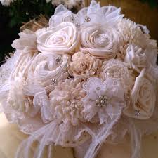 Made popular by the late princess diana, the cascading bouquet features flowers that fall gracefully towards the floor in a dramatic style. This Fabulous Bouquet Was Made From Vintage Lace Balsa Flowers Feathers And Vintage Jewelry What Ma Diy Wedding Bouquet Bridal Bouquet Fabric Flower Bouquet