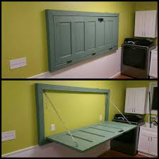 Make A Collapsible Table Out Of An Old Door Laundry Room Remodel Laundry Room Organization Laundry Room Storage