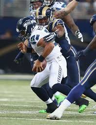 russell wilson 3 of the seattle seahawks is sacked by