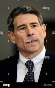 Robert Blagojevich, brother of former Illinois Gov. Rod Blagojevich listens  to his attorney Michael Ettinger, unseen, as he talks to the members of the  media after his hearing at the Federal Court