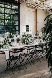 Industrial Reception Decor With Earthy Floral Design Image By Nicole Leever Industrial Wedding Decor Industrial Wedding Inspiration Industrial Wedding Venues