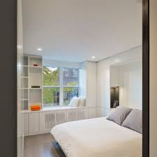 The exposed brick wall, wood floors and tall, sunny windows were already there when this designer showed up. 75 Beautiful Small Modern Bedroom Pictures Ideas June 2021 Houzz