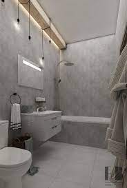By changing the style in the upper third of a wall, you can exaggerate height in the room. Grey Bathroom Interior Interior Design Ideas