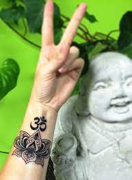 The richness of the lotus booming alongside the most elegant om symbol adds great value to this 3d tattoo designs. 38 Lotus Tattoos On Wrist