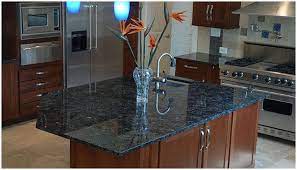 Mirror Polished Blue Granite Countertop Works Beautifully With The Dark Natural Wood Of The Cabinets Blue Granite Countertops Blue Countertops Blue Granite