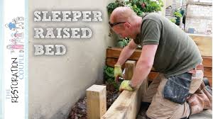 Determine the vertical distance of your yard from the top to the bottom of the slope (the rise), as well as its horizontal distance (the run), by pounding a wooden stake into the ground at the top of the slope and a second stake at the bottom. Building A Timber Retaining Wall Using Oak Sleepers Youtube