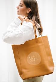 Download Premium Psd Of Woman Carrying A Brown Handbag Mockup 1215167 In 2020 Brown Handbag Tan Leather Bag Design Mockup Free