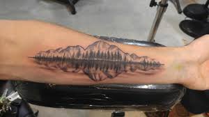 This subreddit is intended for posting your own personal tattoos, but also includes: A Soundwave That Turns Into Trees And Mountains Reflected On Water Done By Ben At Chalice In Boise Id Tattoo Lover Family