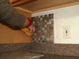 If the tile has been cut, make sure you're placing it in the right spot. How To Install A Kitchen Tile Backsplash Hgtv