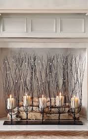 This holder elevates each candle at a different height for a more artistic look. 47 Adorable Fireplace Candle Displays For Any Interior Digsdigs