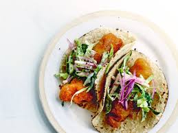 Once oil reaches 350 degrees, dredge each fillet in batter. The Perfect Fish Taco Recipe Courtesy Of A New Cookbook Dedicated To California Vogue
