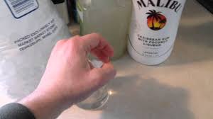 Rum liqueur malibu with coconut flavor can be drunk in its pure form or used to make cocktails. Tropical Malibu Rum And Limeaide Cocktail Drink Recipe Youtube