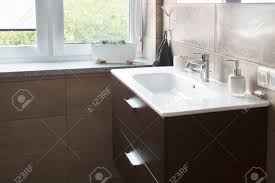 white sink in the large bathroom next