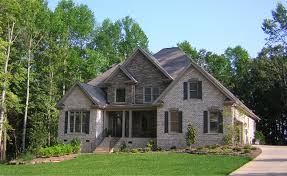 Mixing Stone And Brick Gives The Exterior Of This Newly Constructed Allegheny Home A Distinctively Europe House Exterior Exterior Brick French Country Exterior