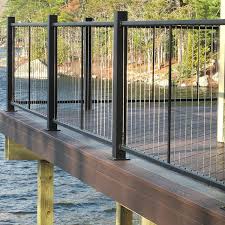 Cable railing uses stainless steel fittings and wire to complete the posts, rails, and intermediate pickets are made from reinforced aluminum or wood which can stand up to the cables tension. The Fortress Vertical Cable Railing System Is Easy To Assemble And Deck Railings Railings Outdoor Cable Railing Deck