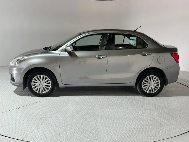 The sleek, original factory Silver finish of the 2022 Suzuki Dzire., AI generated