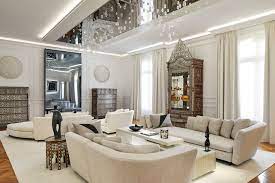 Eastern pieces in a turkish rug and wooden table cube give it character. A Contemporary Apartment Between Modern Design And Antique Treasures