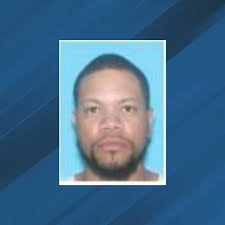 Man still wanted, facing charges of assaulting government officials