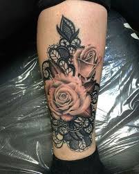 Done in inks resembling lipstick stains, this beautiful kiss from a rose could adorn shoulders, hips, and sides for a sexy, sultry look. Lace Tattoo Design On Leg Lace Tattoo Design Lace Tattoo Wrist Tattoos For Women