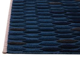 One of the keys to getting a layered rug look right is texture. Pond Is A Tactile Collection Of Handwoven Rugs With A Variation Of Heights And Structures By Charlotte Von Der Lancken Scandinaviandesign Com