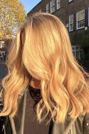She has long bangs which covered her forehead with blonde hair color. Champagne Blonde Is The New Blonde Hair Hue Trend Glamour Uk