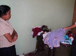 Poono | Woman works in a shop with 3 other tailors. | mle2114 | Flickr