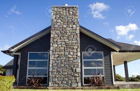 Estimates in minutes · 24/7 project support · millions of reviews A Modern Home Exterior With A Stone Chimney Stock Photo Picture And Royalty Free Image Image 9738375