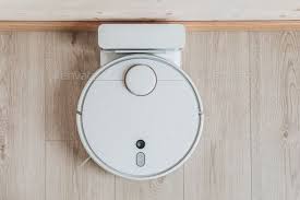 Wireless Robot Vacuum Cleaner Return To Charging At Dock In Clean Wooden Floor Cleaning Wooden Floors Robot Vacuum Cleaner Robot Vacuum