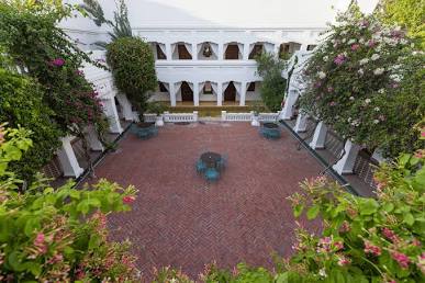 Atmospheric courtyard at Saraca Hotel, AI generated