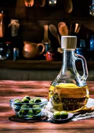Olive Oil Bottle With Olives Arrange On Table In Old Fashioned In 2020 Olive Oil Bottles Oil Bottle Old Fashioned