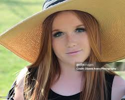 Red Haired Girl In Sunhat High-Res Stock Photo