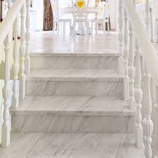 Two minimalist home interiors featuring light grey and white decor with natural wood accents, plus modern furniture designs and contemporary lighting ideas. China Customized Indoor White Beige Marble Staircase Stair Tread Design China Marble Staircase Stair Tread Design White Beige Marble Staircase Stair Tread Design